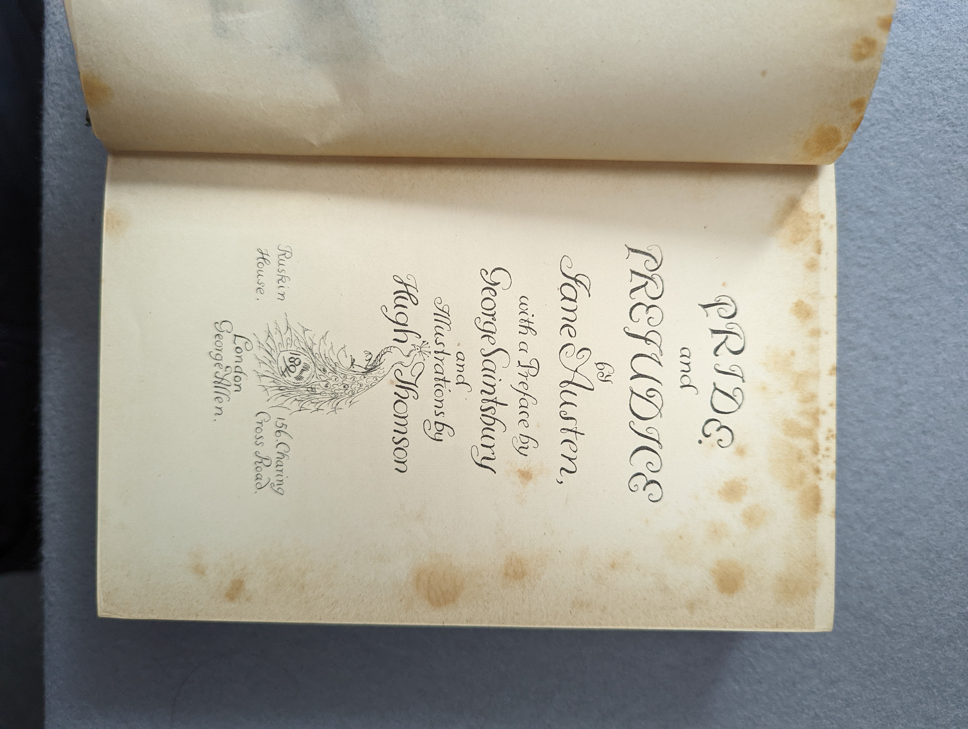 Austen, Jane - Pride and Prejudice... with a preface by George Sainsbury and illustrations by Hugh Thomson; dark blue / green publisher's cloth, upper cover and spine gilt overall in the 'Peacock' design, ge. and dark bl